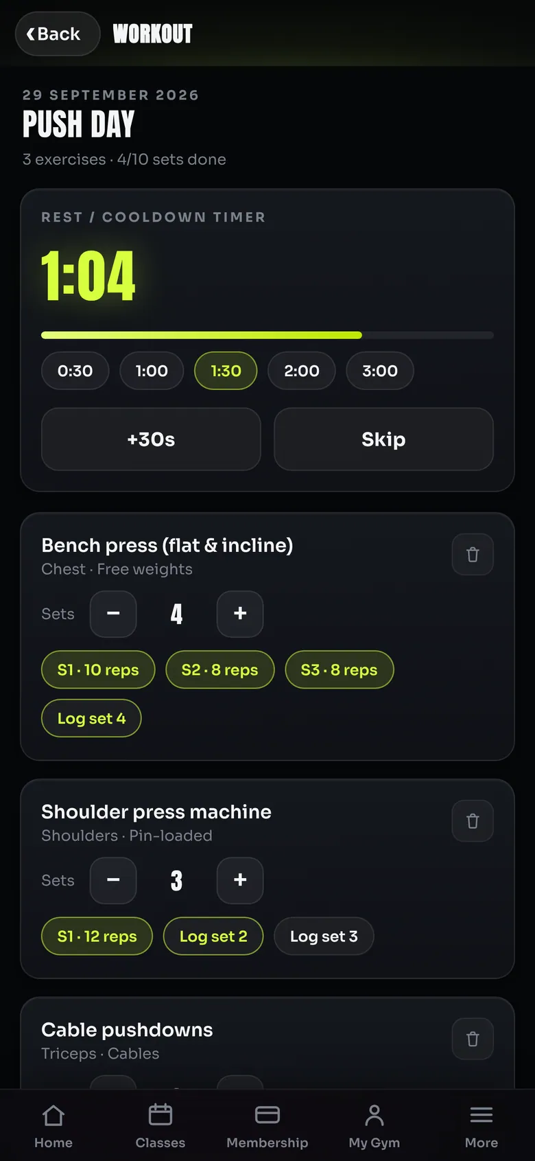 Workout screen for Push day with a running rest timer at 1:04 and exercises showing sets and logged reps
